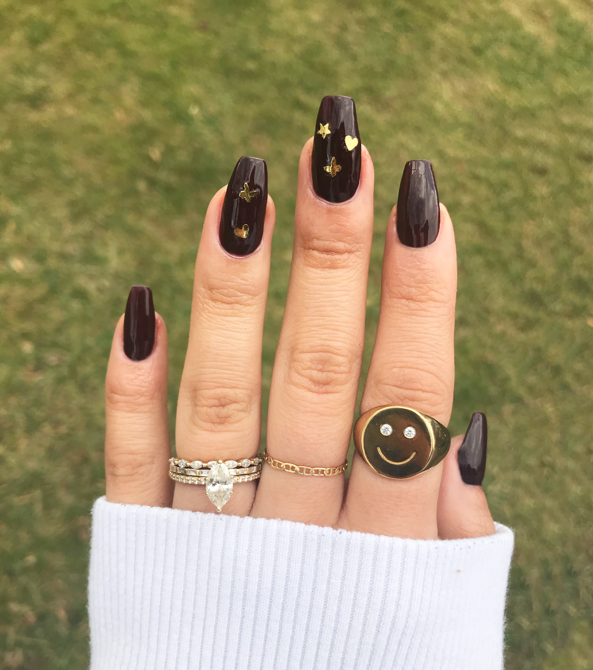 oxblood red nails with gold sticker art
